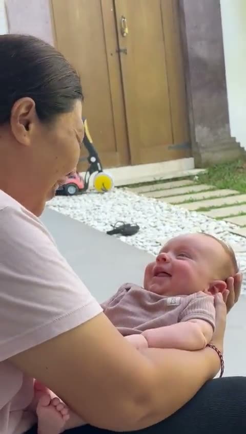 Our nanny with a smiling baby at a Bali villa